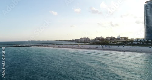 Aerial view of a ship leaving the Miami harbor.