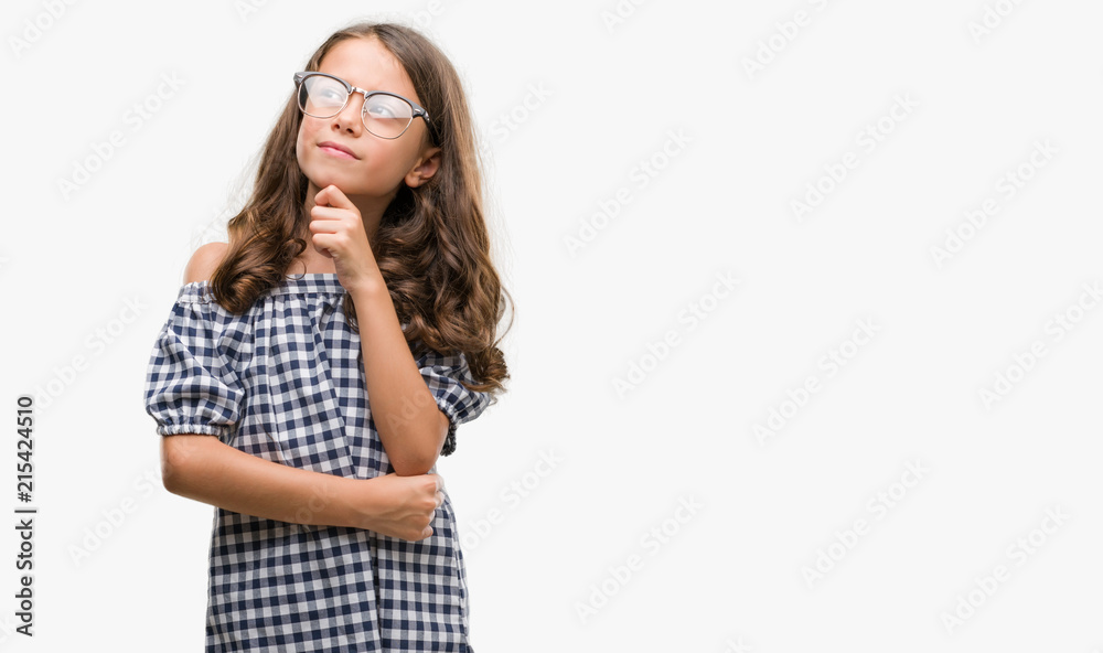 Brunette hispanic girl wearing glasses serious face thinking about question, very confused idea Brunette hispanic girl wearing glasses serious face thinking about question, very confused idea