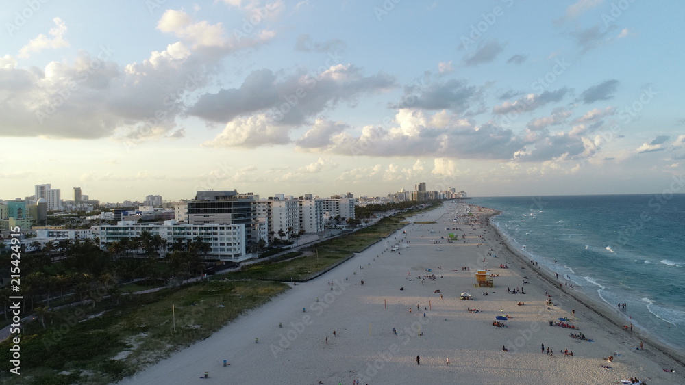 Aerial view of people relaxing on the beach in Miami. Aerial view of people relaxing on the beach in Miami.