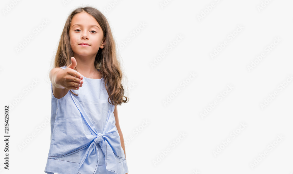 Brunette hispanic girl smiling friendly offering handshake as greeting and welcoming. Successful business. Brunette hispanic girl smiling friendly offering handshake as greeting and welcoming. Successful business.