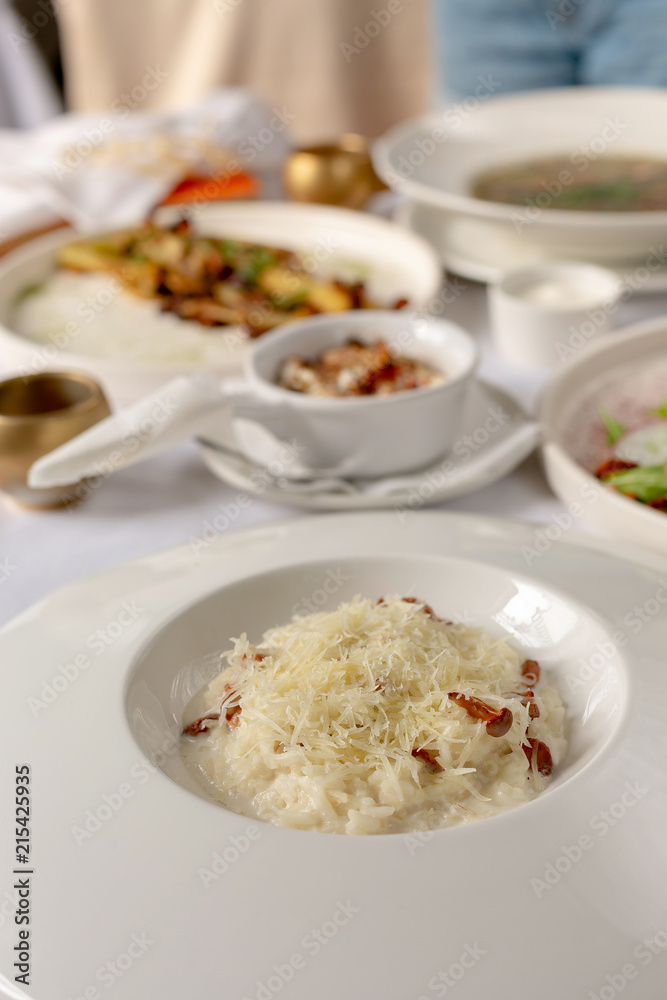 Close-up risotto with chanterelle mushrooms and grated parmesan