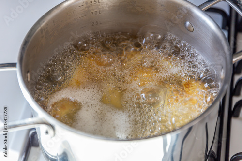 Pan of potatoes cooking in boiling water