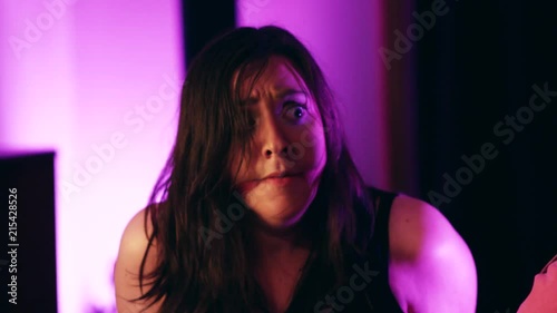 Two woman bound and gagged panic as they look around the room