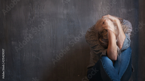 Konstfotografi Depression, abuse. Woman sitting with hands on her head