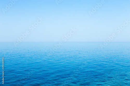 Fototapeta Naklejka Na Ścianę i Meble -  Beautiful seascape without clouds. Perfectly clean smooth sea and clear blue sky
