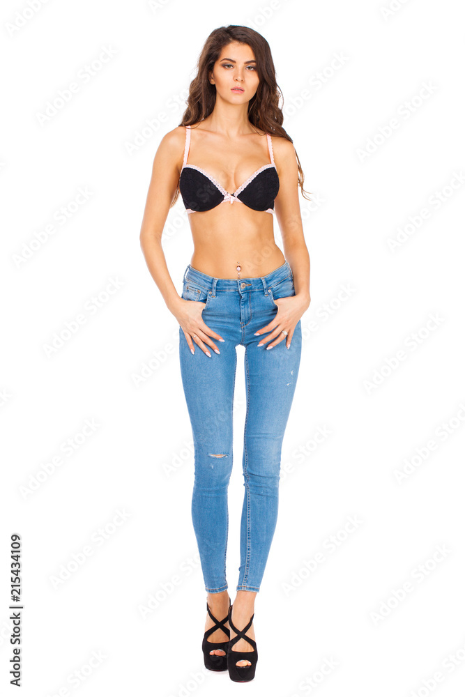 Young beautiful brunette woman in blue jeans Young beautiful brunette woman in blue jeans