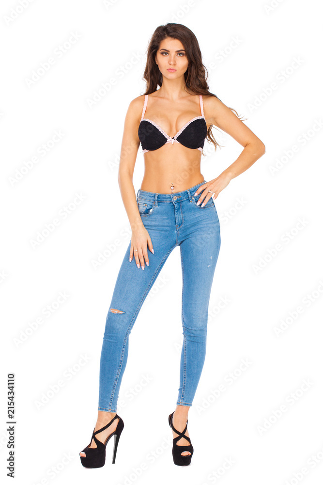 Young beautiful brunette woman in blue jeans Young beautiful brunette woman in blue jeans