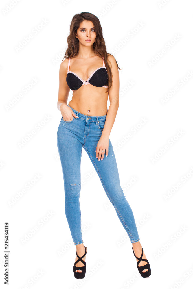 Young beautiful brunette woman in blue jeans Young beautiful brunette woman in blue jeans