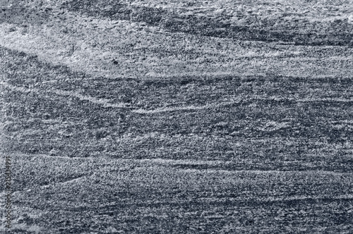Migmatitic gneiss migmatite rock bands pattern grey light dark banded granite texture macro closeup textured silver gray horizontal background coarse grained feldspar quartz mica minerals gneissic photo