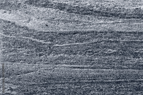 Migmatitic gneiss migmatite rock bands pattern grey light dark banded granite texture macro closeup textured silver gray horizontal background coarse grained feldspar quartz mica minerals gneissic