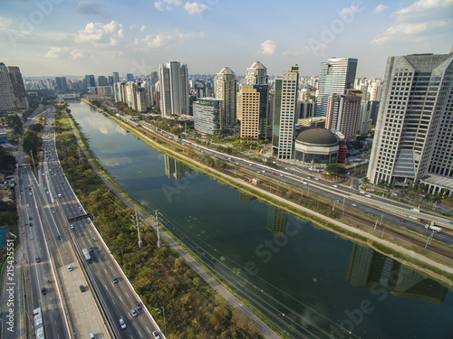 Large cities with river or sea and buildings, aerial view of the "Marginal Pinheiros" Avenue, Pinheiros River and skyline of Sao Paulo city 