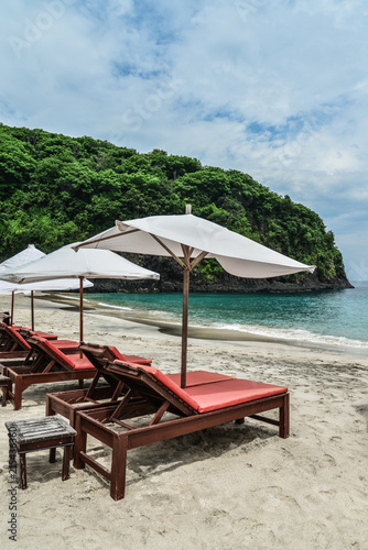 Beach lounge chairs with umbrella