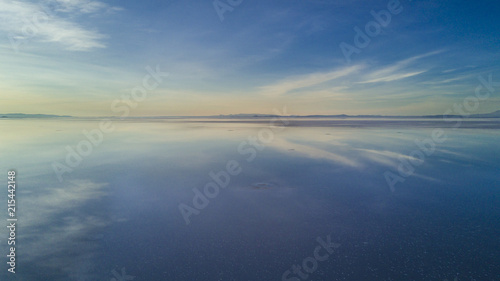 Aerial Uyuni reflections are one of the most amazing things that a photographer can see. Here we can see how the sunrise over an infinite horizon with the Uyuni salt flats making a wonderful mirror. 