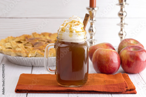 Hot Caramel Apple Cider with an Apple Pie and Cinnamon Stick