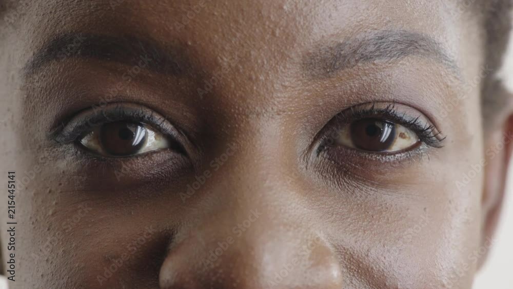 close up beautiful african american woman eyes opening looking at camera female beauty 