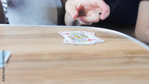 Friends playing cards on train photo