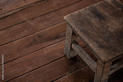 brown short old chair wooden vintage style on wooden background with copy space . © Rattanachai