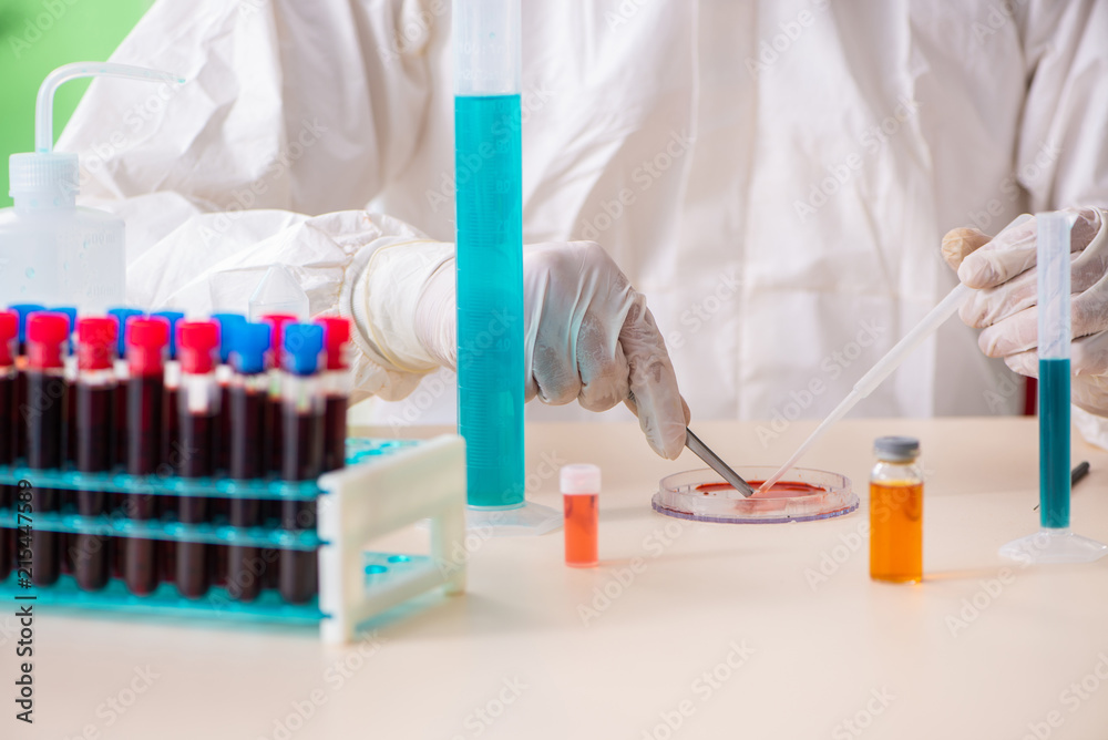 Chemist working in the lab on new experiment Chemist working in the lab on new experiment