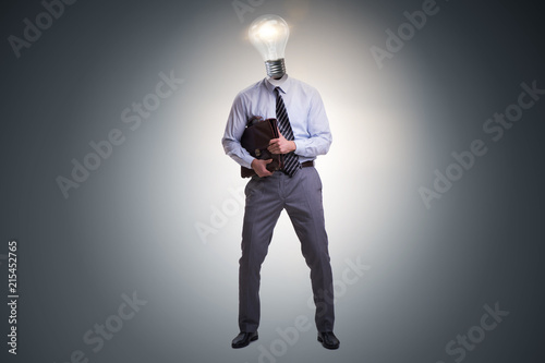 Businessman in bright idea concept with lightbulb head © Elnur
