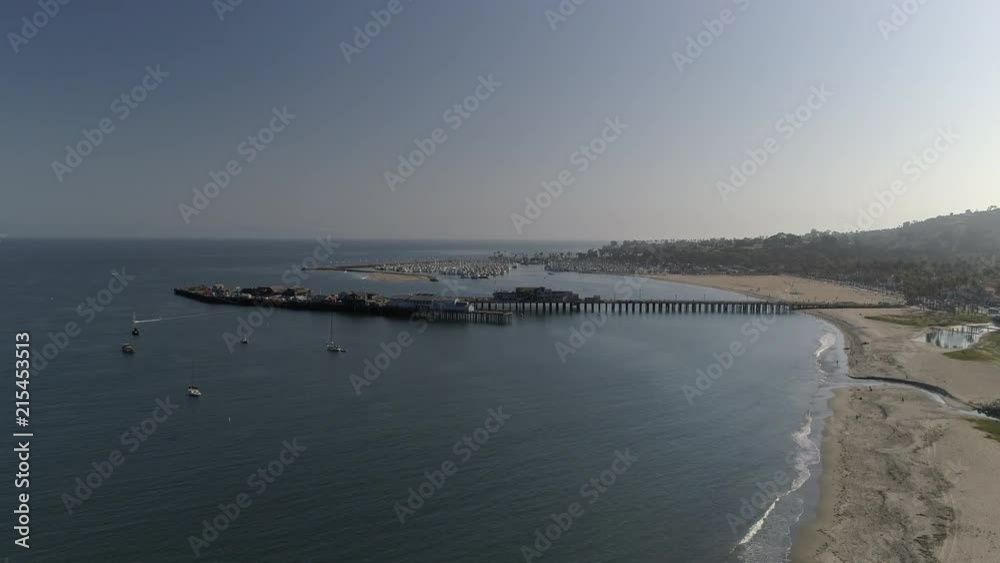 Aerial shot of Santa Barbara Ocean Pier and Palm Trees lining the Highway Aerial shot of Santa Barbara Ocean Pier and Palm Trees lining the Highway