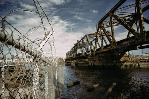 Razor Wire by Abandoned Train Bridge