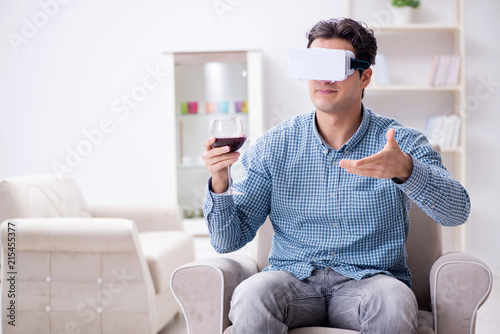 Young man drinking wine at home © Elnur