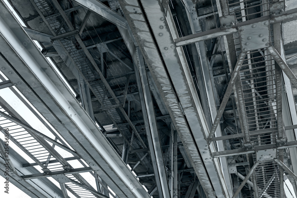 rusty steel railroad bridge trusses. industrial background