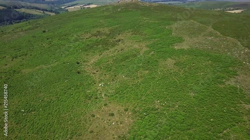 Wallpaper Mural Backward tracking aerial across the rocky outcrops on the edge of Dartmoor, Fields in the background. Devon, England Torontodigital.ca