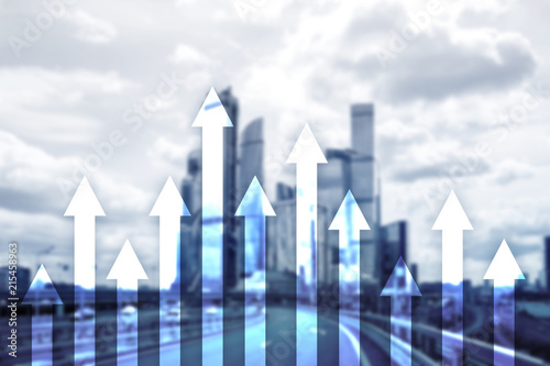 Up arrow graph on skyscraper background. Invesment and financial growth concept.