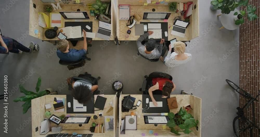 cheerful businessman celebrating success giving colleagues high five enjoying successful teamwork in multi ethnic office workplace top view