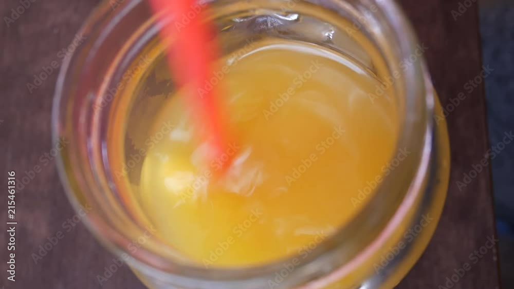 Cold orange drink in a thick glass Close up Cold orange drink in a thick glass Close up