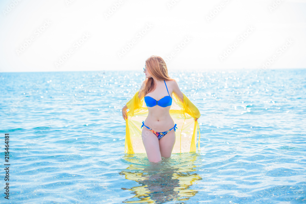 Obraz premium Beauty of new age. Natural pretty young girl in swimsuit near the sea. Size plus and xl lady. Swimsuit bikini ,babe at vacation having fun and enjoy the life. Lifestyle modern woman