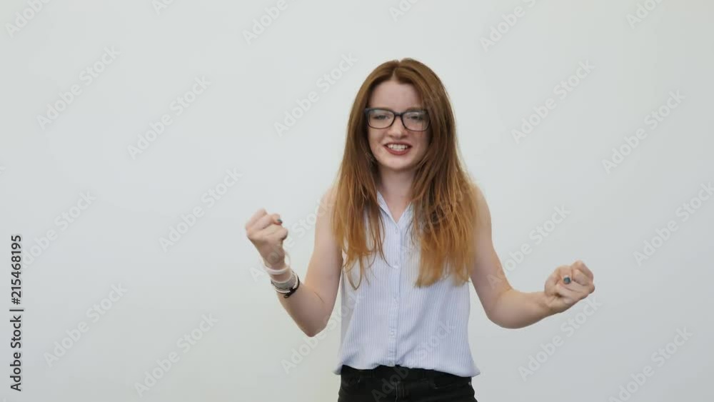 A female student is very happy and expresses the enormous emotions of success. Yes. A female student is very happy and expresses the enormous emotions of success. Yes.