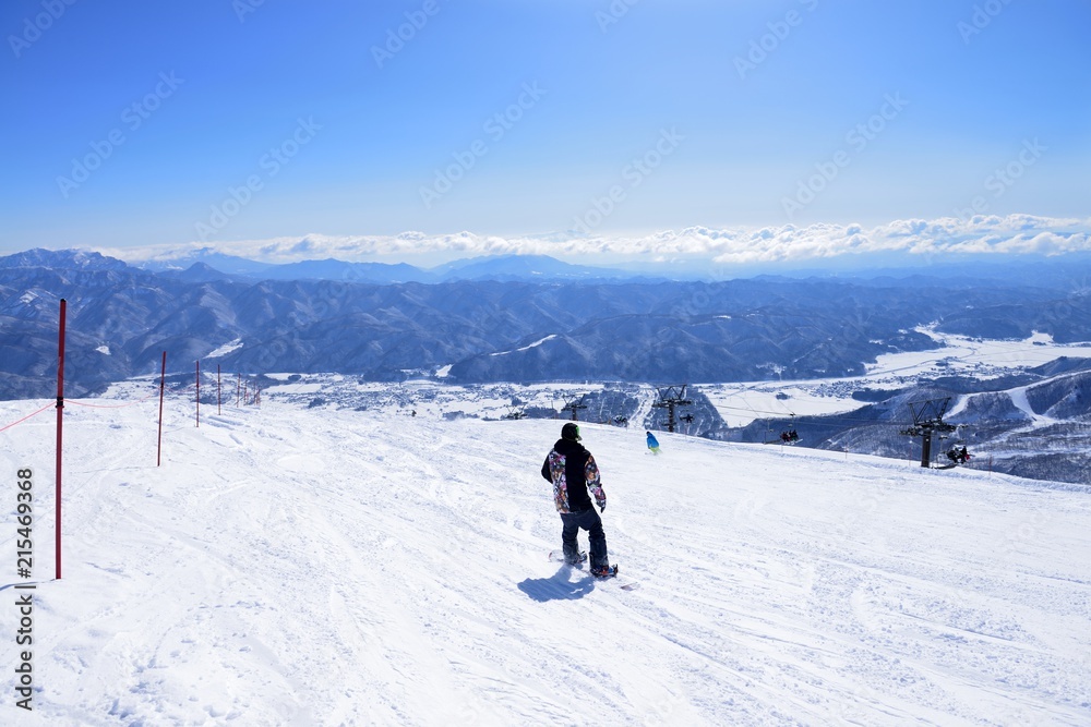 Panoramic snow boarding at hakuba happo in Nagano Japan with blue