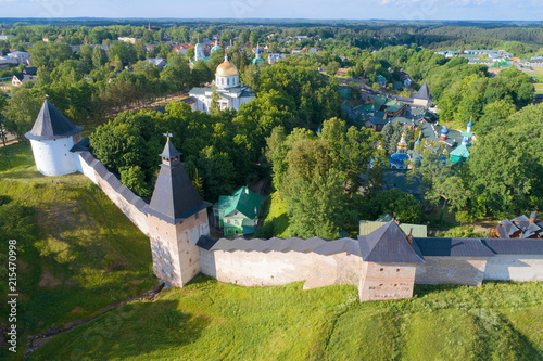 A June morning at the walls of the Holy Dormition Pskovo-Pechersky Monastery (aerial survey). Pechory, Russia