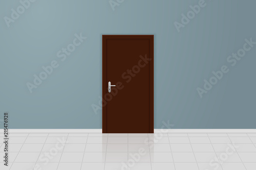 Brown wooden door on a gray wall. Interior design