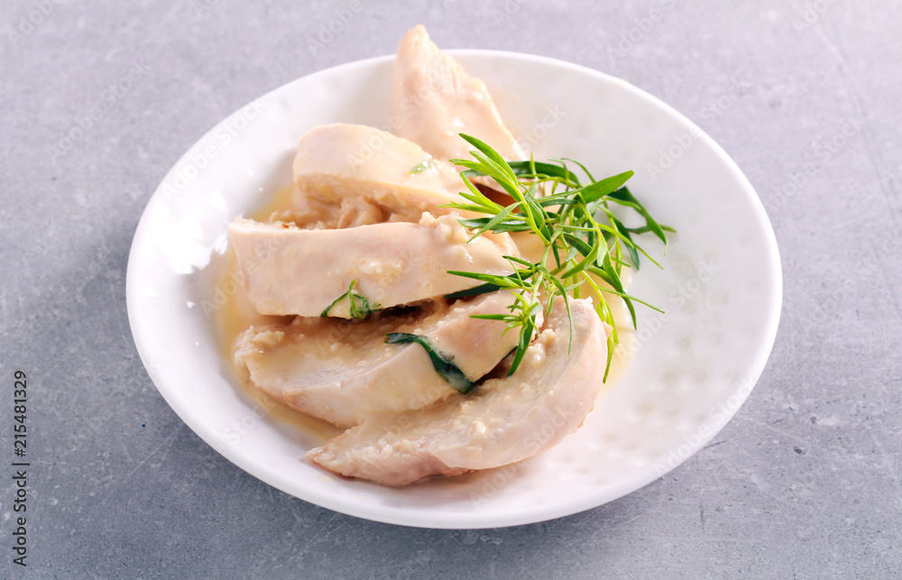 Tarragon chicken with sauce , sliced and served Tarragon chicken with sauce , sliced and served