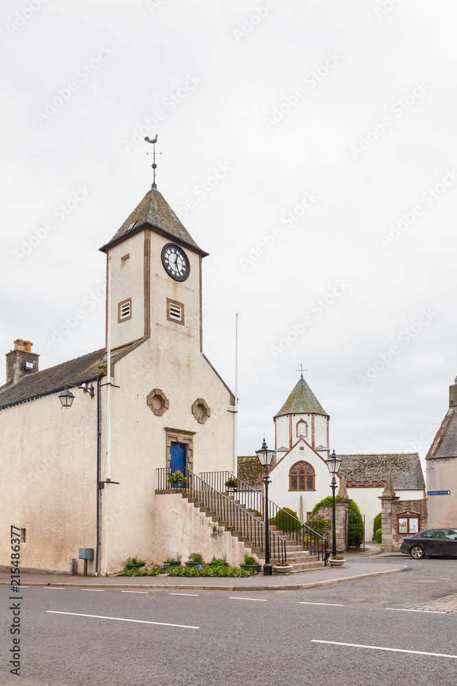 Obraz premium Lauder Town Hall. Lauder Town Hall, formerly a tollbooth, is pictured in Lauder town centre in the Scottish Borders. Behind can be seen Lauder Old Parish Church.
