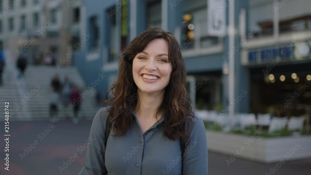portrait of lovely elegant independent woman smiling happy cheerful on urban sidewalk portrait of lovely elegant independent woman smiling happy cheerful on urban sidewalk