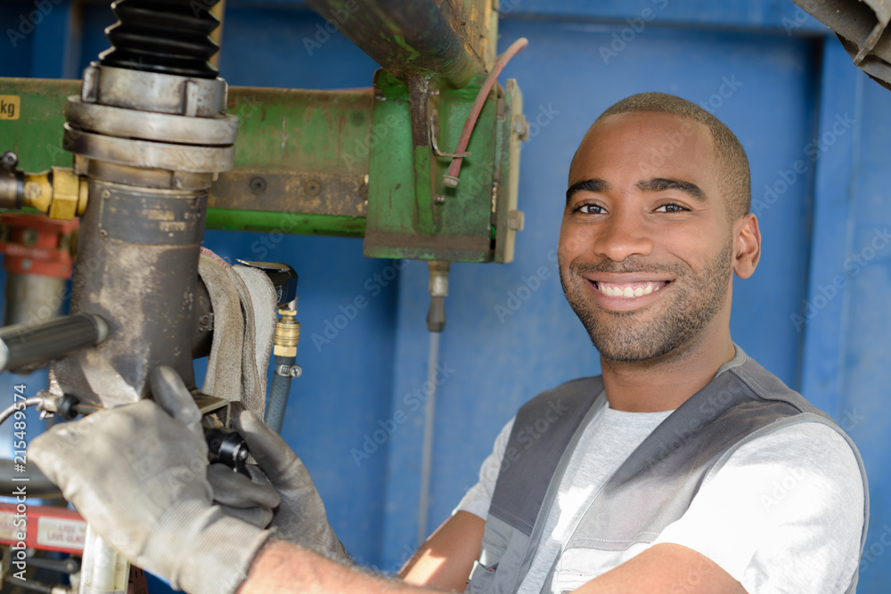 young metalworking engineer operating milling machine young metalworking engineer operating milling machine