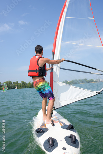 windsurfing on a lake