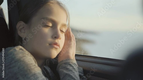 A child sleeps in a Car