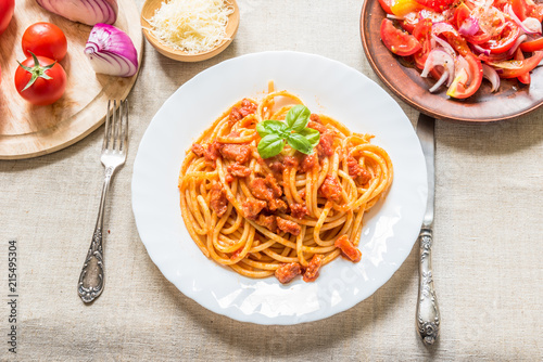 Traditional Italian lunch - Pasta Ammatricana and salad