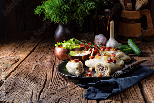 Rustic Cepelinai, a specialty Lithuanian and Polish cuisine. photo