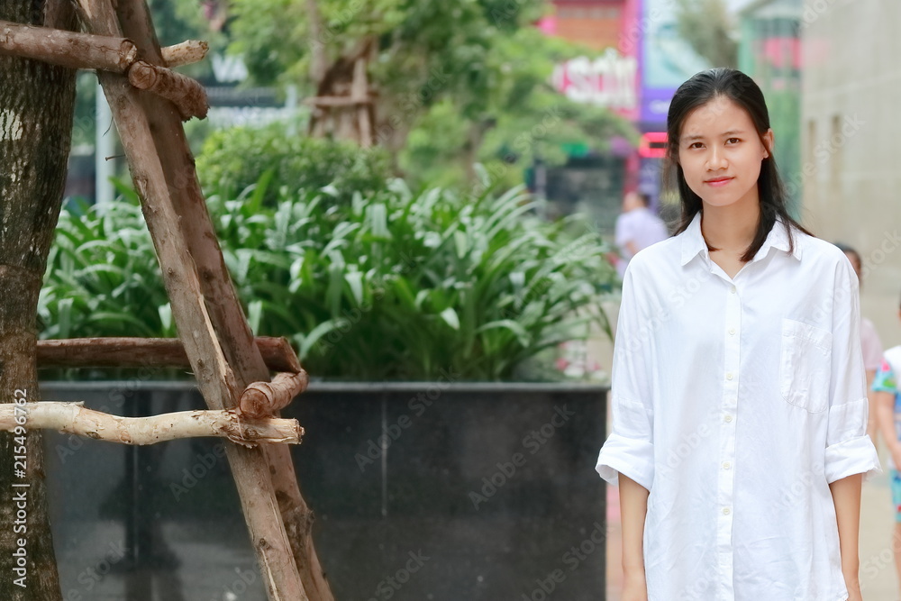 a woman walking in downtown in Vietnam a woman walking in downtown in Vietnam