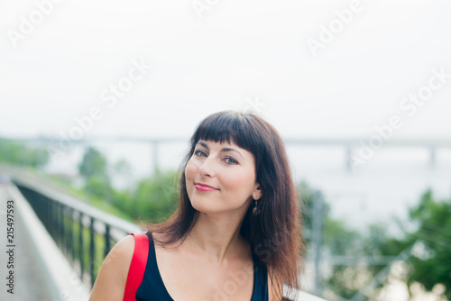 Outdoors portrait of young woman in summer near river, stock photo image