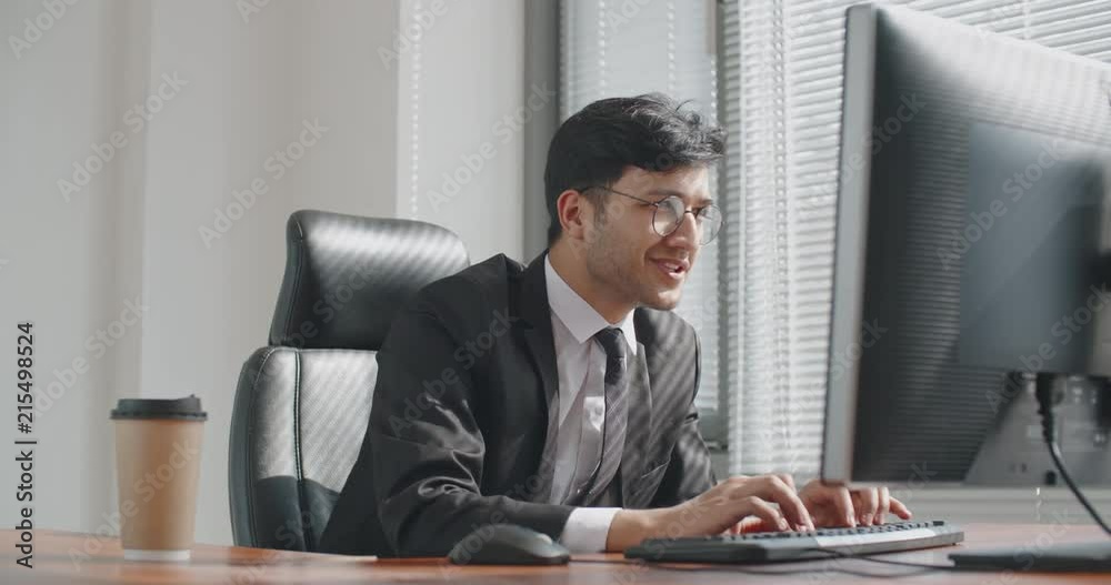 young south asian businessman working at computer,then doing victory dance after promotion. busineessman happy after successful deal. business, victory concept 4k young south asian businessman working at computer,then doing victory dance after promotion. busineessman happy after successful deal. business, victory concept 4k