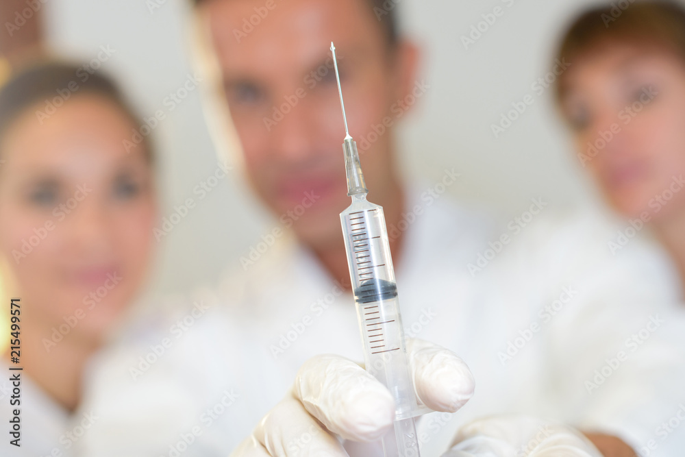 giving injection to patient giving injection to patient