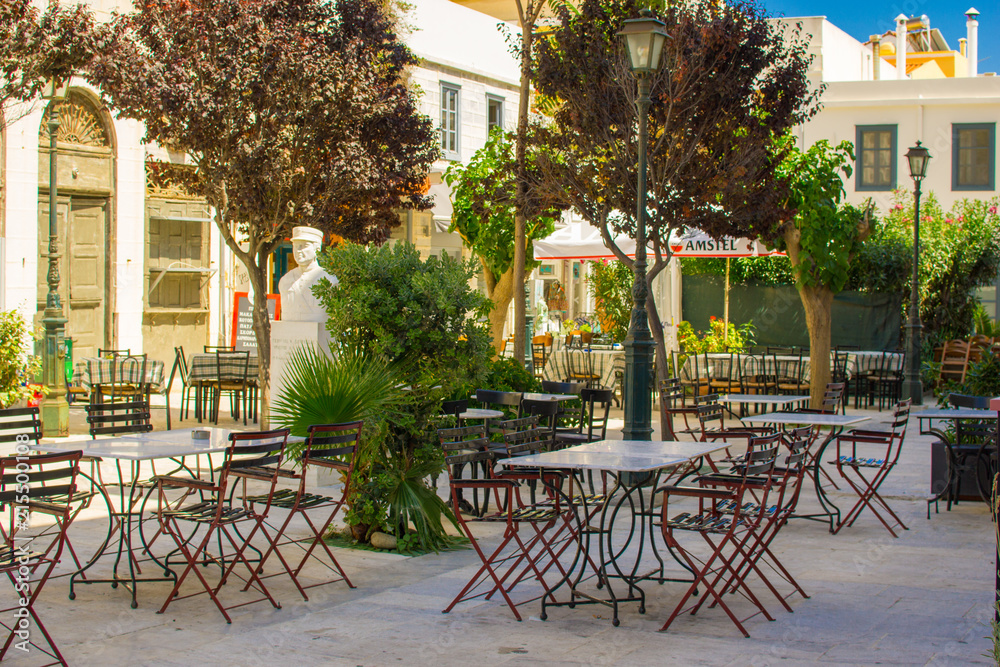 Picturesque empty tranquil cafe in the center of Ermoupoli in Syros island, Cyclades, Greece