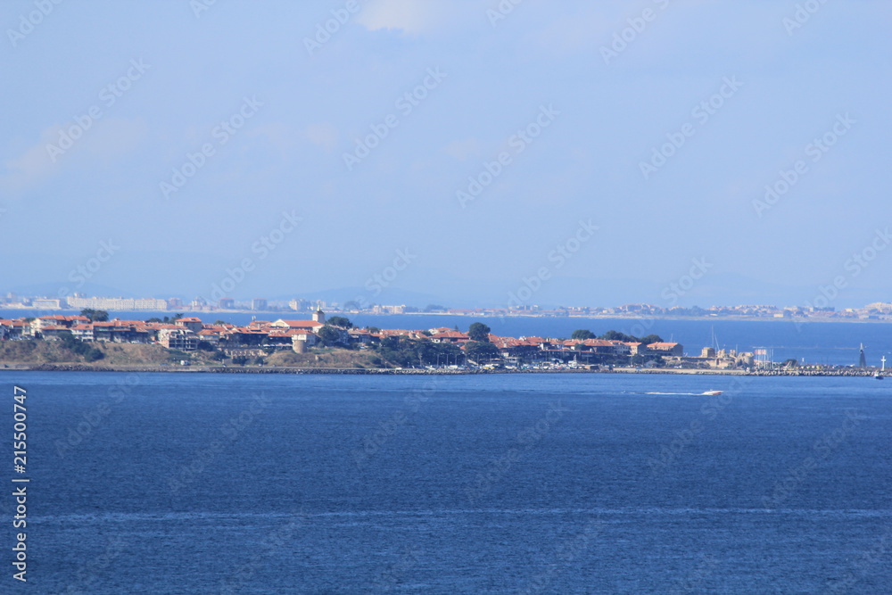 blue sea and sky, a view of the coastal strip with houses and beaches